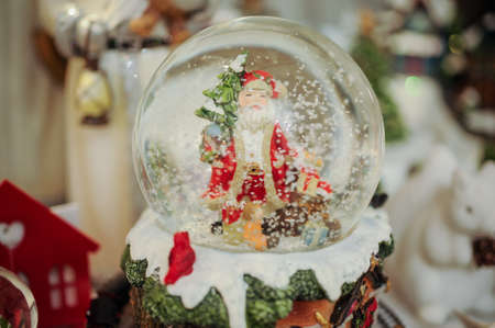 Christmas snow globe with santa clous insideの写真素材