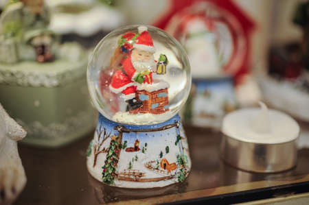 Christmas snow globe with santa clous insideの写真素材