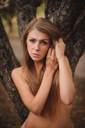 Mehndi. Nice topless girl with floral pattern on handsの写真素材