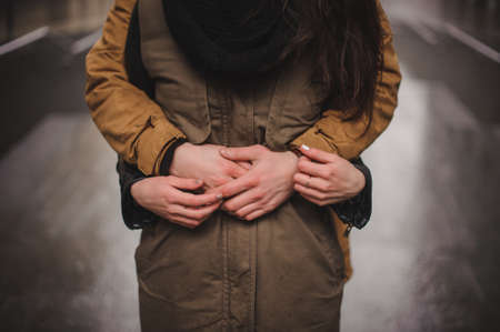 lovely young couple hugging outdoors in autumn no faceの写真素材