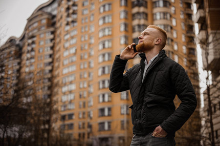 ginger man talking on the phone outdoors