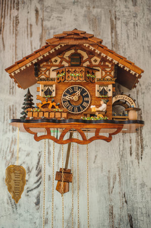 an antique cuckoo clock hanging on the wall
