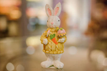 Easter colorfull bunny figurine on table close upの写真素材