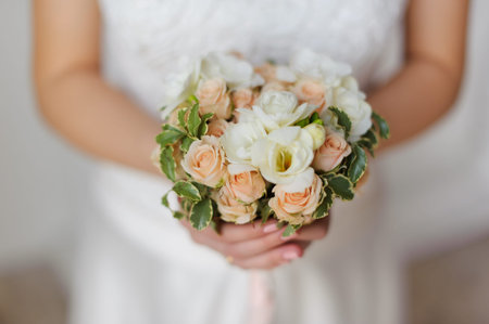 Bride in white dress with a wedding bouquet. no face