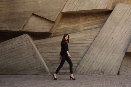 young business woman walking outdoors on hillsの写真素材