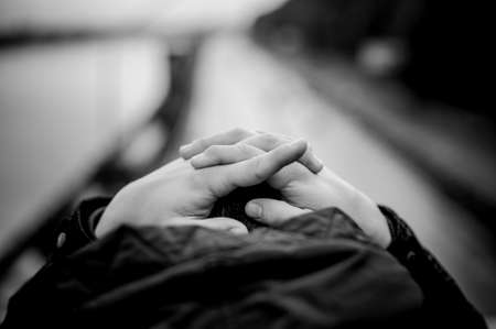 Crossed Hands in black and white of man  no faceの写真素材