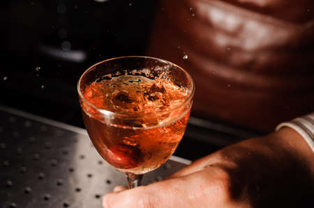 Barman at work, serving cocktails at bar . no faceの写真素材