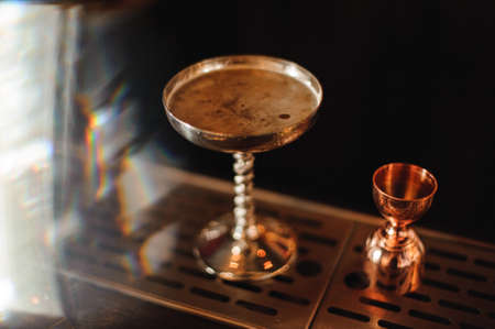 cocktail in a metal glass on barの写真素材