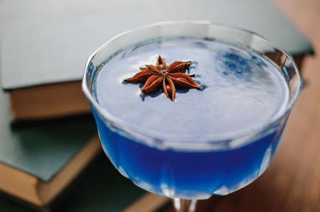blue cocktail with star anise close up photoの写真素材