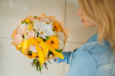 girl holding a bouquet of white flowers no faceの写真素材