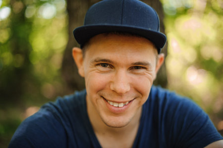 Smiling handsome young man wearing a cap