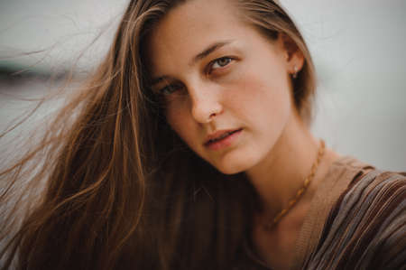 Outdoors portrait of beautiful young brunette girlの写真素材