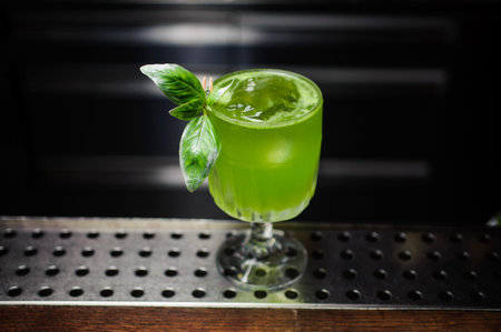 green gin basil smash cocktail at the bar