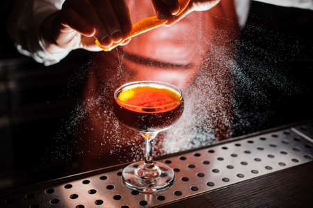Orange garnish spray over a drink. no faceの写真素材