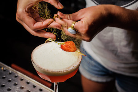 dusting cocktail drink with food color no faceの写真素材