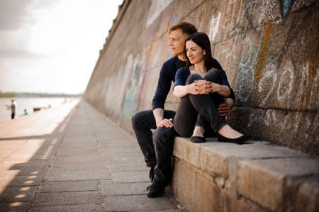 Romantic couple embracing in love enjoying a viewの写真素材