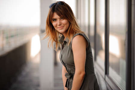 Young woman outdoors portrait. Soft sunny colors. close upの写真素材