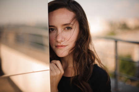 Portrait of a teenage girl against city viewの写真素材