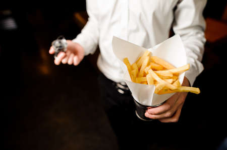 Waiter with french fried potatoesの写真素材