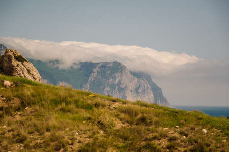 Clouds over the mountain. Seascape. Nature conceptual imageの写真素材