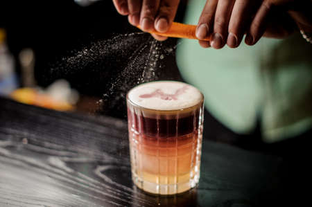 Bartender decorates New York sour cocktail no faceの写真素材