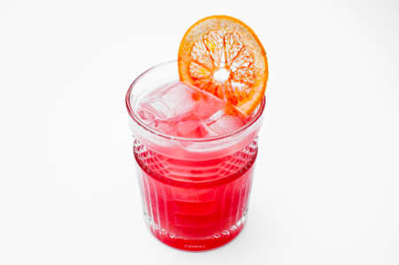 pink cocktail decorated with a slice of grapefruit, isolated on white backgroundの写真素材
