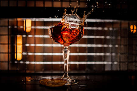 Splash of fresh cocktail on a dark backgroundの写真素材