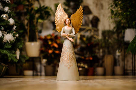 Close up beautiful angel stone sculpture with a sweet expression that looks down fragment of sculptureの写真素材