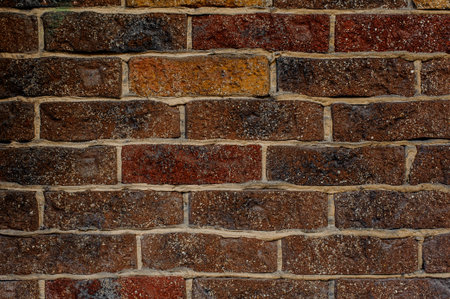 Red brick rustic textured background with a light color cement in a seams. Decorative bricks wall...