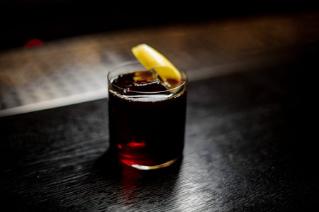 Glass of a Hamms Delight cocktail with orange zest