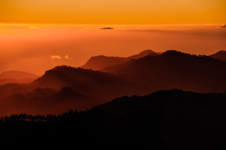 GRAN CANARIA,SPAIN - Gorgeous landscape of the sunset in orange beautiful hills in mountains Roque...