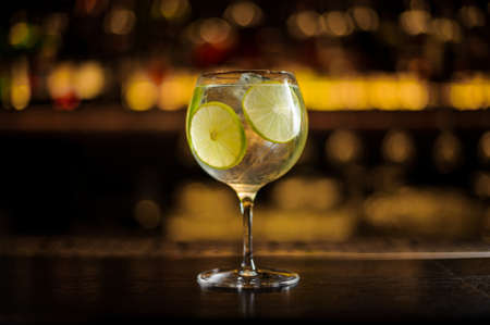 Elegant cocktail glass with fresh sour and sweet citrus cocktailの写真素材