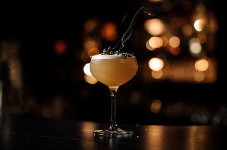 Light brown cocktail on a bar counterの写真素材