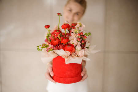 All kinds of flowers in round red hat boxの写真素材