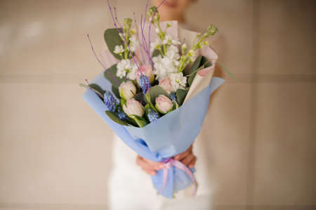 Gorgeuos lush bouquet in a womans handsの写真素材