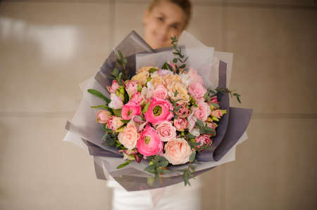 Very beautiful bouquet of roses in gray wrappingの写真素材