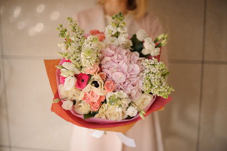 Close shot of bouquet of roses in pink wrapping