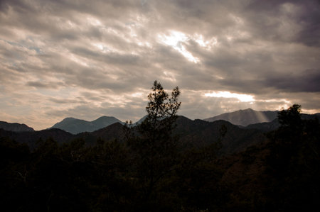 Landscape of the mountain under the cloudy sky with lightの写真素材