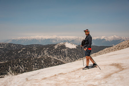 Male traveller with hiking equipment in mountains