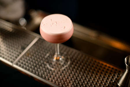 Close-up of small glass with alcohol cocktailの写真素材