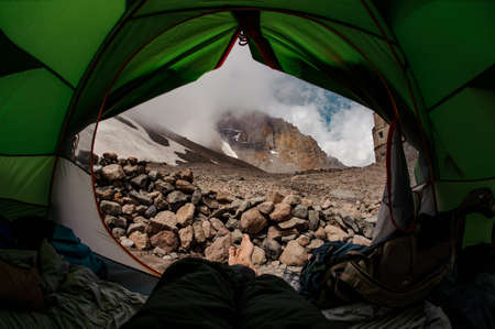 First person view from tent at mountainsの写真素材