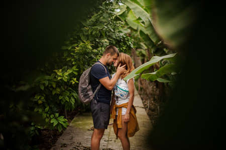 Lovely couple cuddle on path in woodsの写真素材