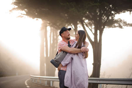 Beautiful couple hugging each other in forestの写真素材