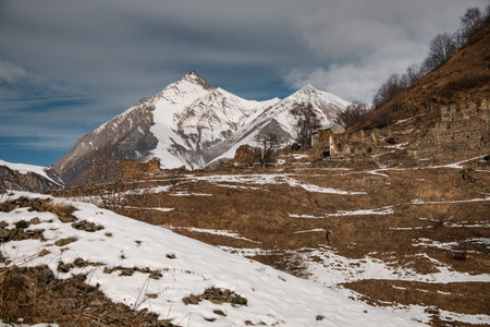 Scene with ancient ruins in snowy mountains