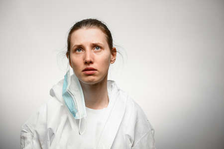 close-up of young woman with martyr face with medical maskの写真素材