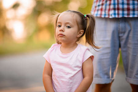 Portrait of lovely little girl with blue eyes and blond hairの写真素材