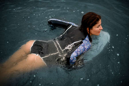 Close-up view of woman floating on the waterの写真素材