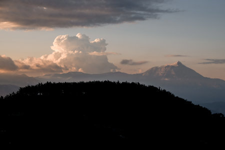 Amazing view of sky with big clouds over mountain landscape. Beauty of wild virgin nature.の写真素材