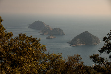 Great view from mountain to seascape with three islands. Beautiful scenery of mountains. Mediterranean sea coast. Nature of Turkey.の写真素材