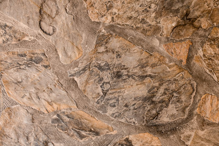 Close-up of cladding wall with natural stone of various shapes
